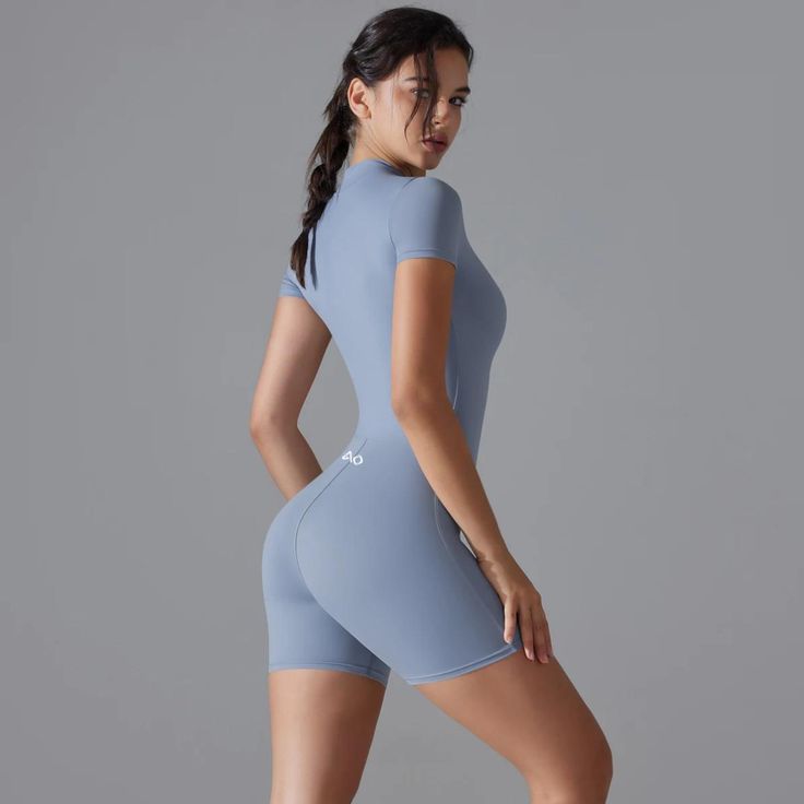 Elevate your activewear collection with the Equilibrium Bodysuit, a perfect blend of style, comfort, and performance. Whether you're flowing through yoga poses or powering through a high-intensity workout, this bodysuit ensures you stay stylish and comfortable.✔️One-Piece Design✔️Zipper Closure✔️Short Sleeves✔️Push-Up Support✔️High-Performance Fabric Fitted Breathable Bodysuit For Yoga, Seamless Yoga Bodysuit, Compressive Seamless Unitard For Yoga, Compressive Seamless Yoga Unitard, Summer Yoga Bodysuit Sportswear, Compression Bodysuit For Yoga With Seamless Construction, Compression Moisture-wicking Bodysuit For Yoga, Seamless Compression Bodysuit For Yoga, High Stretch Casual Bodysuit For Yoga