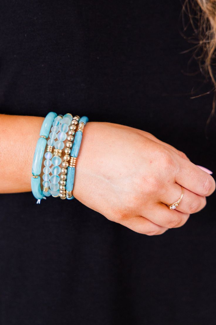 Elevate your style with this fabulous bracelet! This beautiful, beaded design in a lovely blue color can be worn as a set or individually, making it versatile and perfect for any outfit! Show your love and elevate your fashion sense at the same time! Blue Stackable Stretch Bracelet, Stackable Blue Stretch Bracelet, Trendy Turquoise Stackable Beaded Bracelets, Adjustable Blue Stackable Stretch Bracelet, Elegant Blue Friendship Bracelets With Colorful Beads, Elegant Blue Friendship Bracelets With Round Beads, Trendy Turquoise Beaded Bracelets For Friendship, Trendy Blue Stackable Stretch Bracelet, Turquoise Bracelet Jewelry