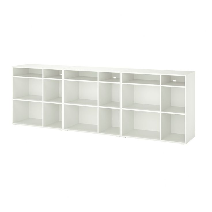 a white bookcase with six shelves on each side