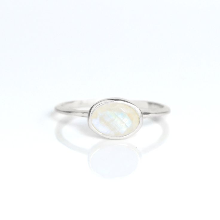 You'll fall in love with an iridescence of this Rainbow Moonstone ring. This is a perfectly sized oval to compliment any collection. Popular as a birthday gift for those June babes and Rainbow Moonstone lovers alike. This stone is beautifully faceted and bezel set in a 925 sterling silver band or plated with 18k vermeil gold. Gemstone is approximately 8 x 6mm.Band has 925 stamp on inside.Please note that each ring is handmade and there may be some slight variations from listing photo.Available i Rainbow Moonstone Ring, June Birthstone, Moonstone Ring, June Birth Stone, Sterling Silver Bands, Rainbow Moonstone, Bezel Setting, Silver Band, Fall In Love