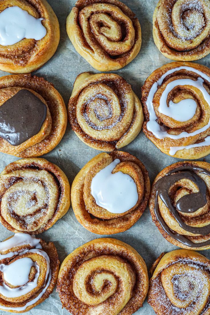 cinnamon rolls with icing and chocolate on top