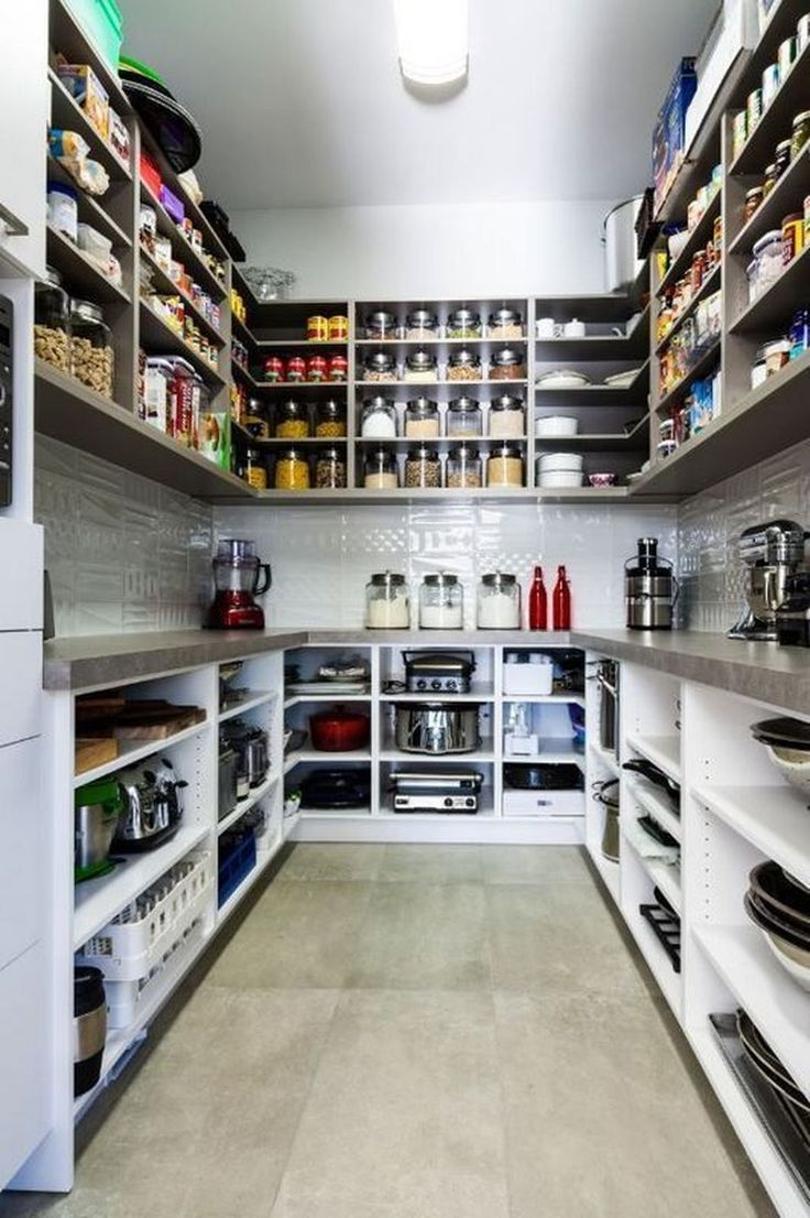 a kitchen filled with lots of different types of food and cooking utensils on shelves