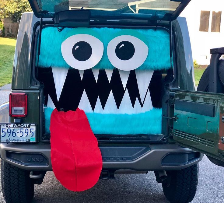 the back end of a vehicle decorated to look like a monster with big eyes and large teeth