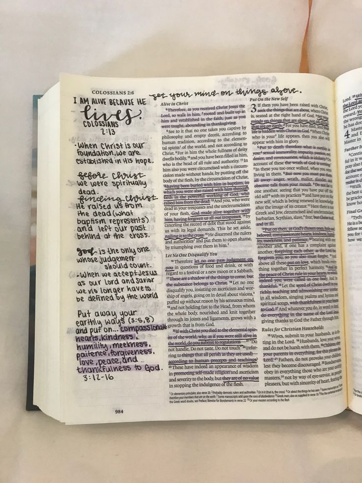 an open bible with writing on it