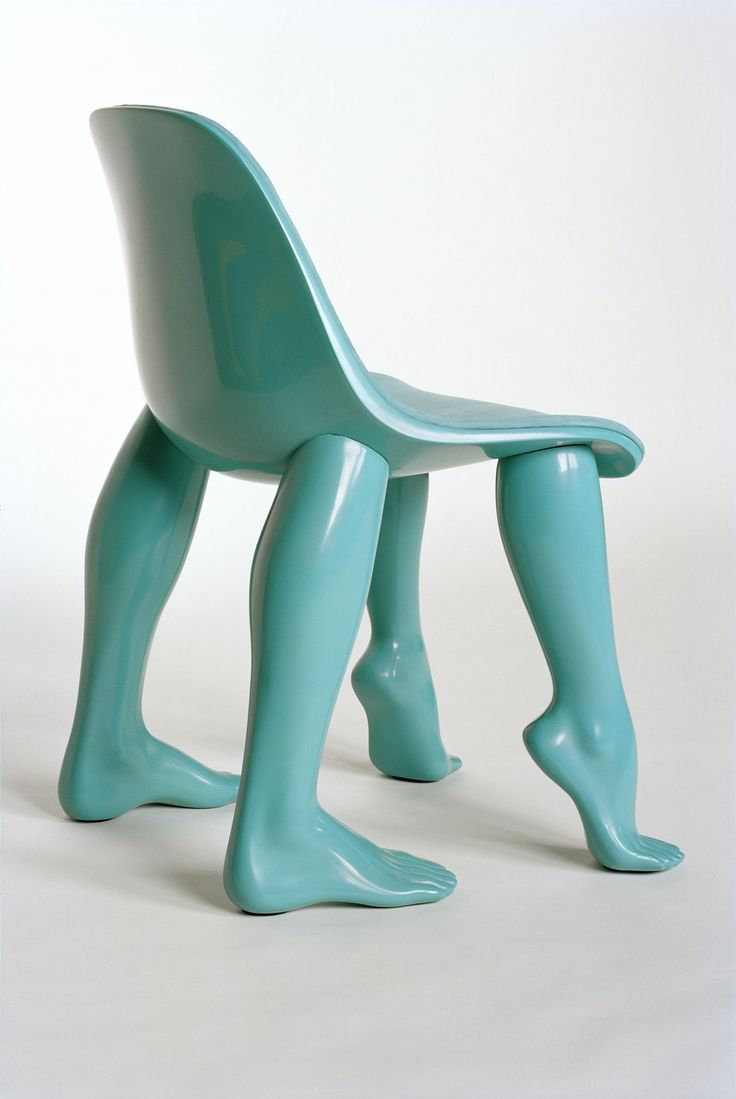 a blue plastic chair with legs and feet on it