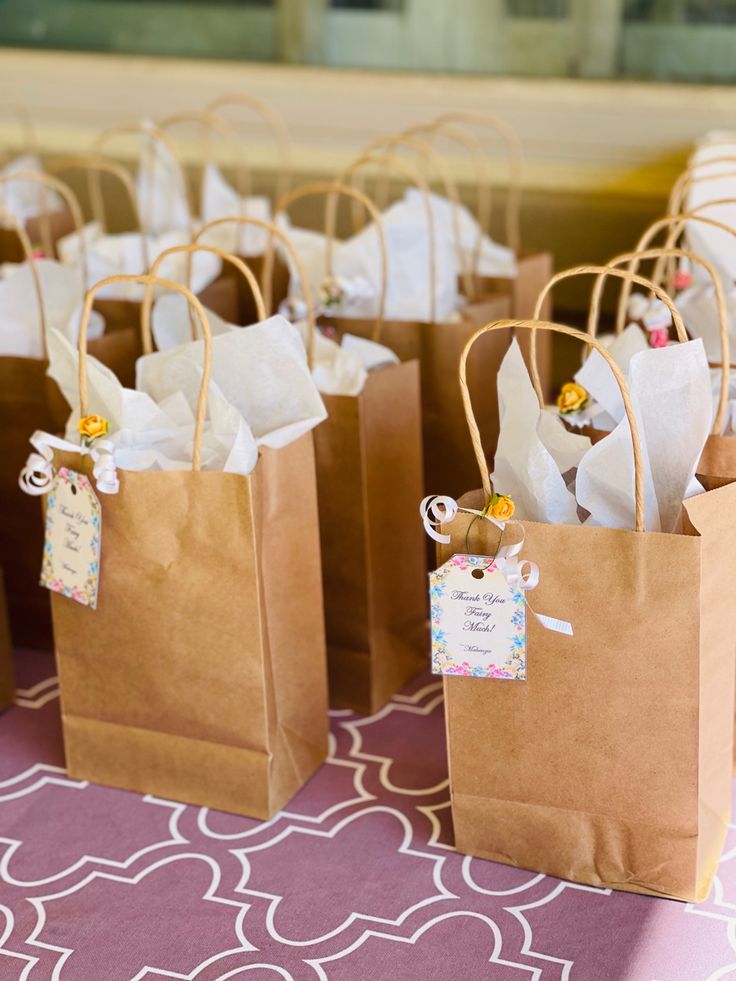 small brown paper bags with tags on them