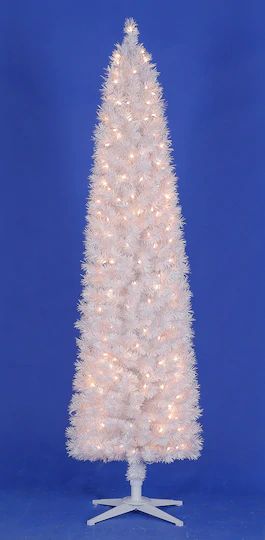 a white christmas tree on a stand against a blue background