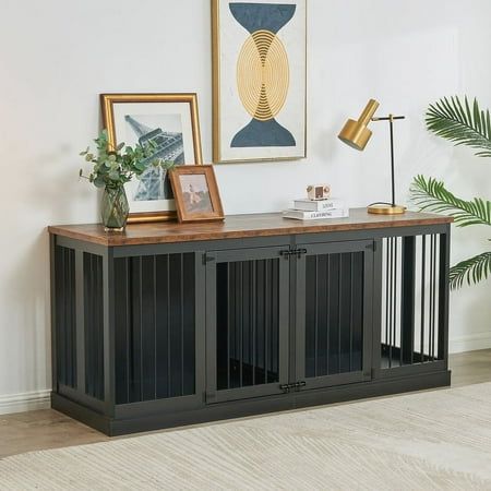 a living room with an entertainment center and pictures on the wall