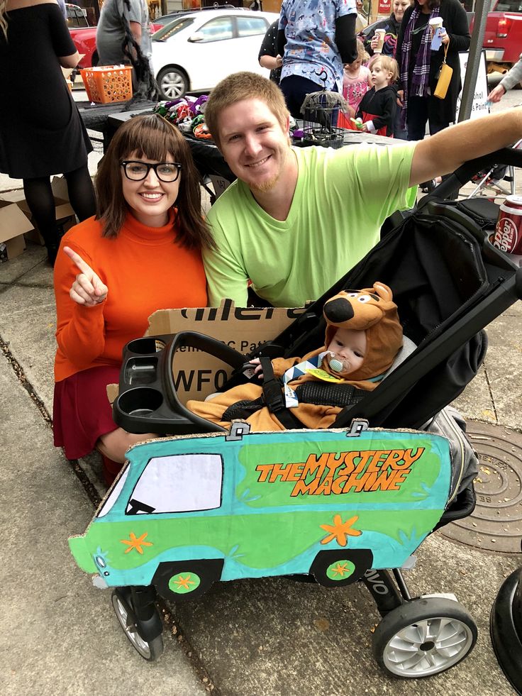 a man and woman sitting in a toy wagon