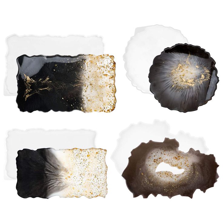 four pieces of paper with gold and black designs on them, one is torn in half