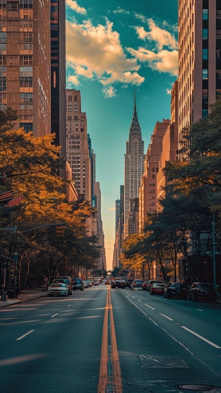 an empty city street lined with tall buildings