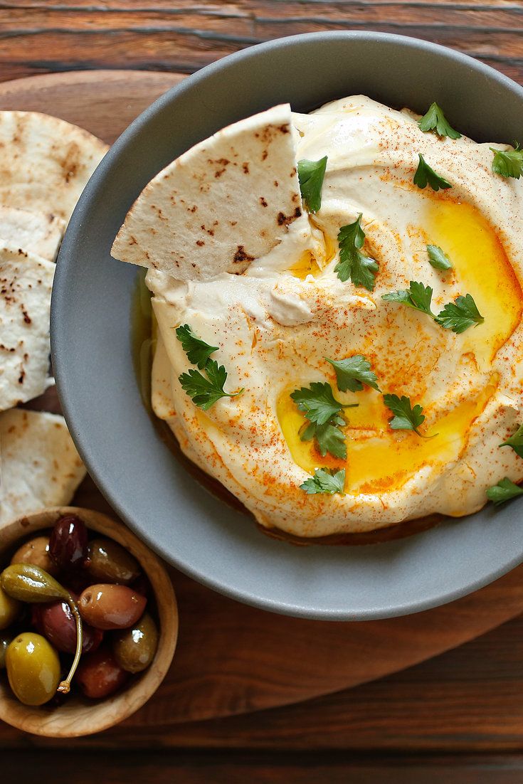 an egg and olive dip with pita chips