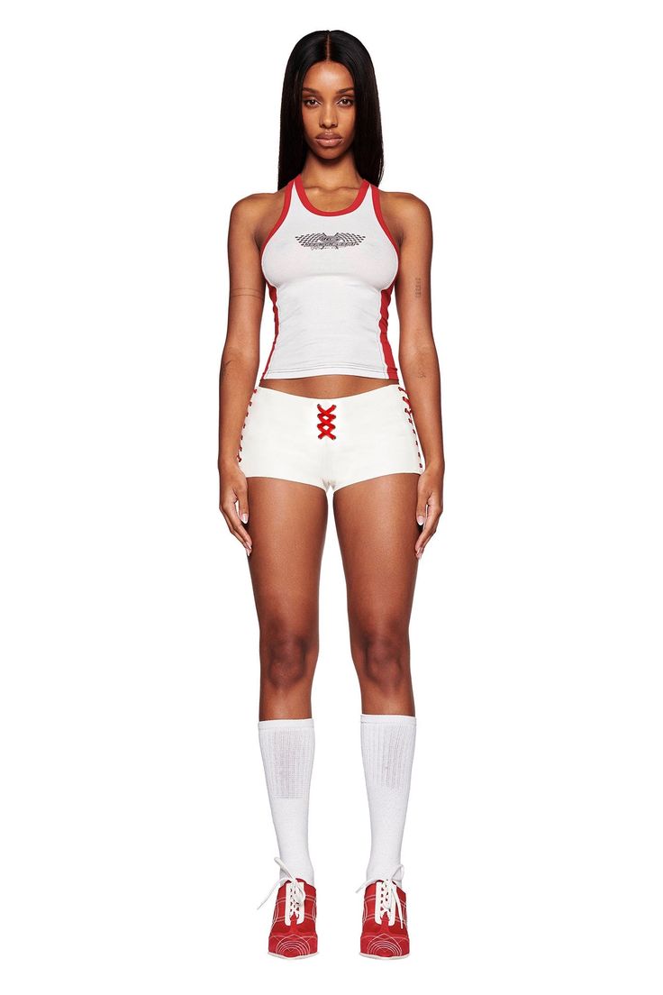 Details White hot shorts in a faux leather fabrication Super mini length and boydcon silhouette Low-rise waist Contrast red satin ribbon detail - Decorative lace up along centre front and sides with metal eyelets Invisible zipper closure at centre back Featuring custom 'GIA G logo at wearer's back bum. Exclusive I.AM.GIA Placement print - Designed in-house by our design and graphics team Unlined - This fabric is not sheer Due to fitting of this garment, we recommend a seamless brief or g-string Mini Skirt Matching Set, White Leather Shorts, Puma Campaign, I Am Gia Set, Long Sleeves And Shorts, Sports Fashion Photography, White Tank Tops, Matching Pjs, Red Panels