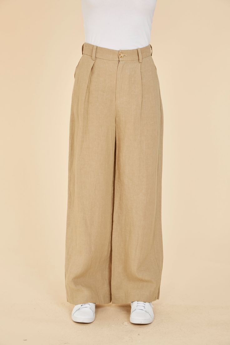 Indulge in breezy comfort with our Linen Wide Leg Pants. Lightweight and comfortable, these pants are the epitome of easygoing style. Their breathability makes them the perfect choice for spring, ensuring you stay cool while exuding effortless elegance. The wide leg adds to the casual vibe, making these pants a versatile and comfortable wardrobe staple for the season. Embrace the airy feel with every step in these spring-ready wide leg linen pants. Linen Wide leg Comes in White and Linen Match w Relaxed Solid Color Pants With Loosely Fitted Hips, Relaxed Solid Pants With Loosely Fitted Hips, Relaxed Wide Leg Pants For Everyday, Relaxed Pants With Loosely Fitted Hips, Relaxed Wide-leg Pants For Everyday, Versatile Beige Straight Pants, Everyday Relaxed Wide-leg Pants, Relaxed Wide Leg Everyday Bottoms, Effortless Wide-leg Spring Pants