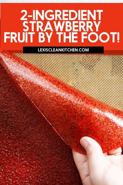 a hand is holding a red substance with the words, 2 ingredient strawberry fruit by the foot