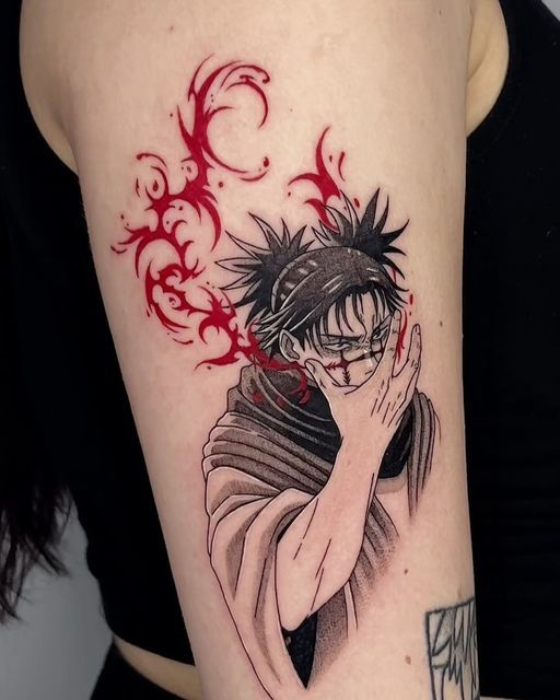 a woman's arm with an anime tattoo on it