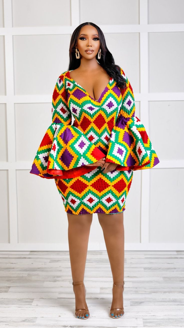 Boss Up in this Efia Kente African Print Midi Dress with majestic sleeves This gorgeous mini dress is ideal for any occasion! Modest but captivating. It can be worn in the office or dressed up for after-work drinks. Perfect For The Efia Kente African Print Midi Dress is perfect for all sorts of functions. Girls night out Casual hangouts Date night Birthday dinner High-end formal events Features V-neckline Non-stretch True to size Mini length Flare sleeve Back zip fastening Extremely flattering f Ankara Dress Styles For Church Flare, Fitted Long Sleeve Dress With Bell Sleeves For Party, Multicolor V-neck Formal Dresses, Fitted Multicolor Midi Dress, Fitted Multicolor Midi Mini Dress, Fitted Multicolor V-neck Dress For Party, Fitted Multicolor V-neck Mini Dress, Multicolor Fitted V-neck Mini Dress, Elegant Multicolor Midi Length Bodycon Dress