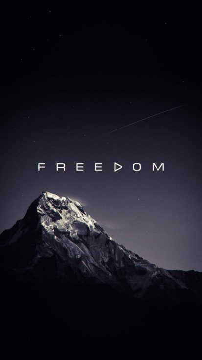 a mountain with the words f freedom on it's side in front of a night sky