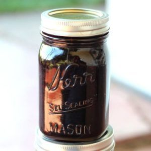 a mason jar sitting on top of a wooden table