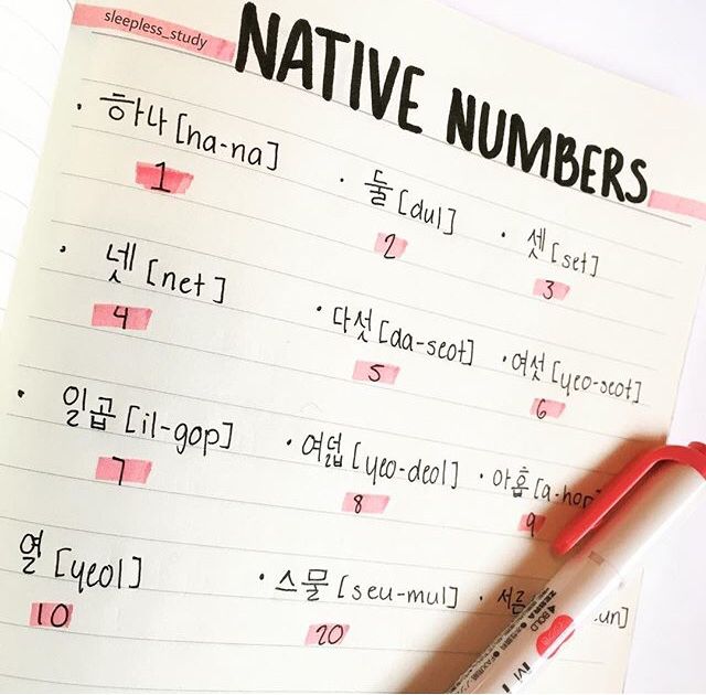 a notepad with writing on it and a pen next to it that says native numbers