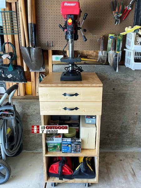 a workbench in a garage with tools and other items on the shelf next to it