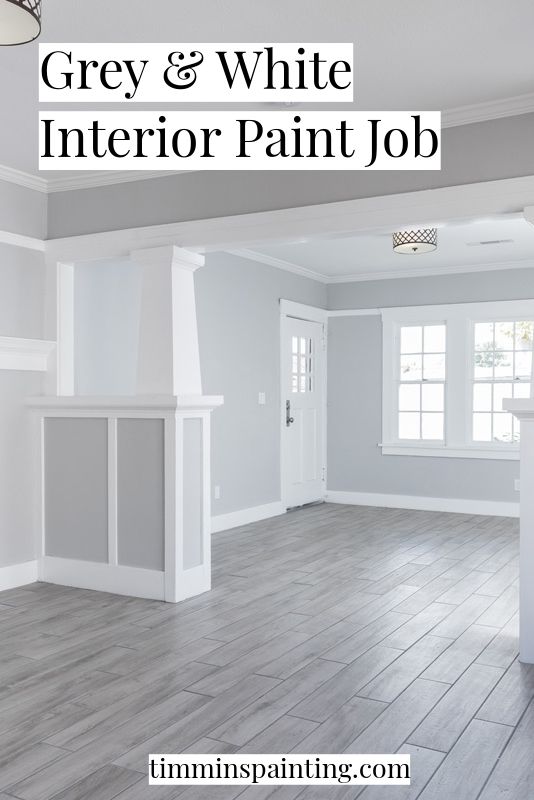 the grey and white interior paint job is being displayed in an empty room with wood flooring