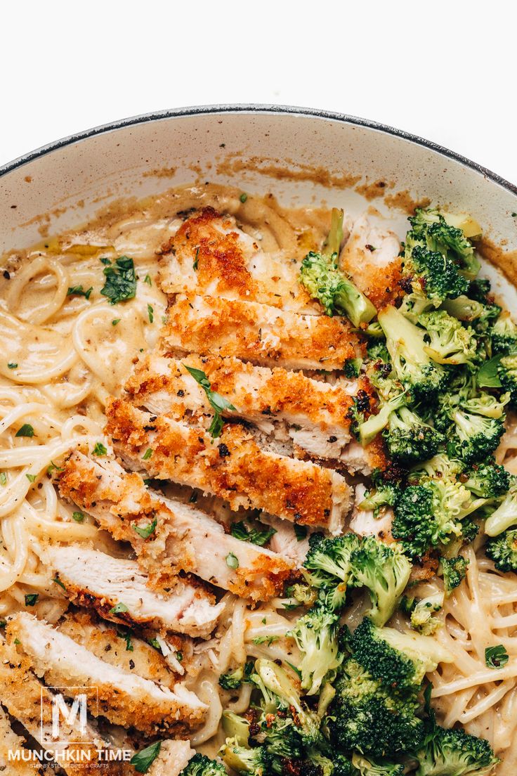 chicken, broccoli and noodles in a white bowl