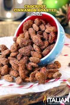 a bowl filled with nuts sitting on top of a table