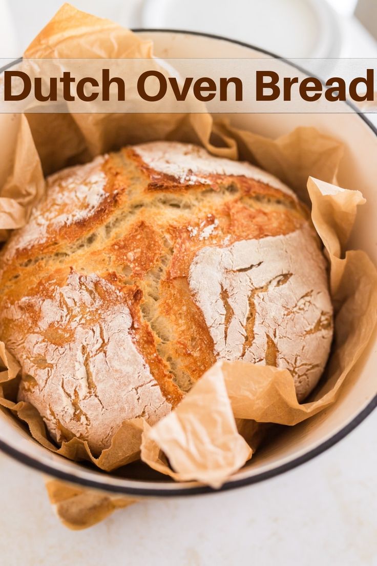 a loaf of bread sitting in a bowl on top of a table