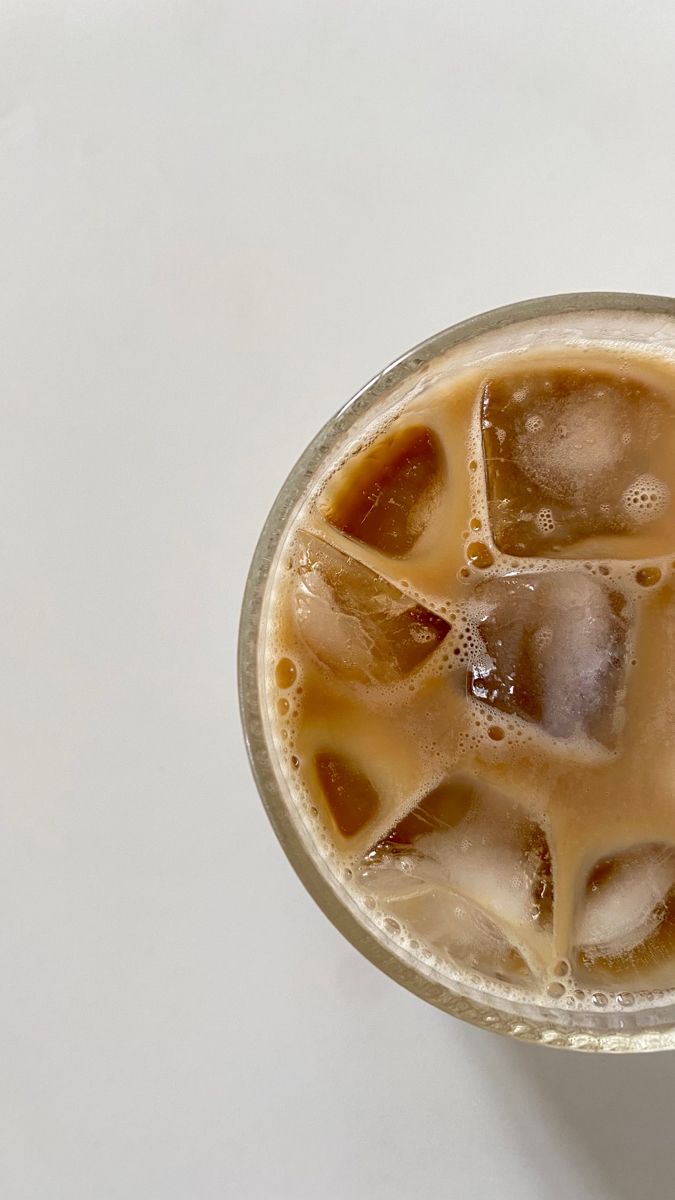 an iced drink in a glass with ice cubes