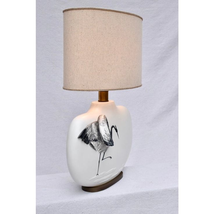 a table lamp with a bird on it