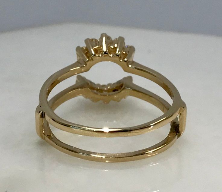 Here is a beautiful 14k yellow gold diamond wrap. With .20cttw. diamonds, it adds just enough extra sparkle to an engagement ring! This wrap goes perfectly with our 14k yellow gold, .80ct. solitaire engagement ring! (sold separately, Sku: 20SB052218-1) Metal: 14K yellow gold Diamond: 10-RB .20cttw. J, VS-2 Finger Size: 7 (please contact us if you need another size) Weight: 3.2 grams SKU# 20SB052218-2AIX If you have any questions on this item, please message us! GandDJewelers.etsy.com 29 Pleasant Gold Brilliant Cut Open Band Wedding Ring, Gold Emerald Cut Heirloom Stackable Rings, Adjustable Yellow Gold Bypass Ring For Anniversary, Yellow Gold Bypass Ring With Prong Setting For Wedding, Wedding Bypass Ring In Yellow Gold, Heirloom Gold Emerald-cut Stackable Rings, Wedding Bypass Ring In Yellow Gold With Open Band, Wedding Yellow Gold Bypass Ring, Gold Bypass Ring With Vs Clarity For Anniversary