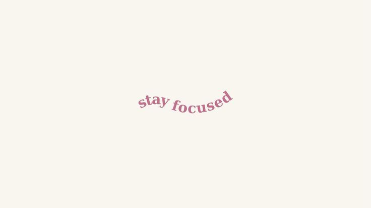 the word stay focused written in pink on a white background