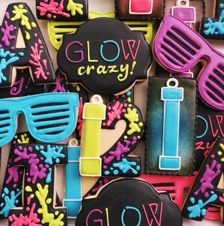 decorated cookies with the words glow, crazy and sunglasses on them are displayed in front of a white background