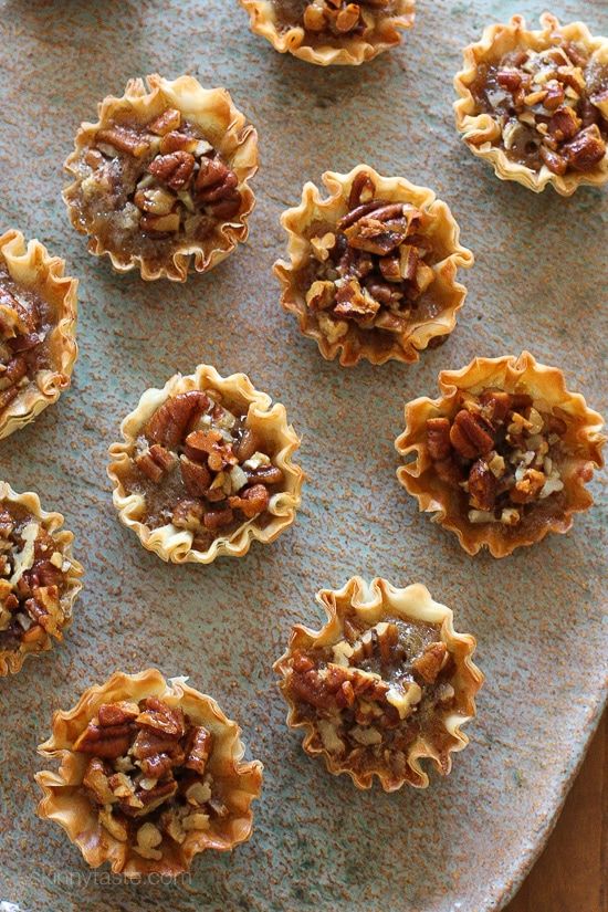 twelve pecan phyllo tarts on a baking sheet with text overlay