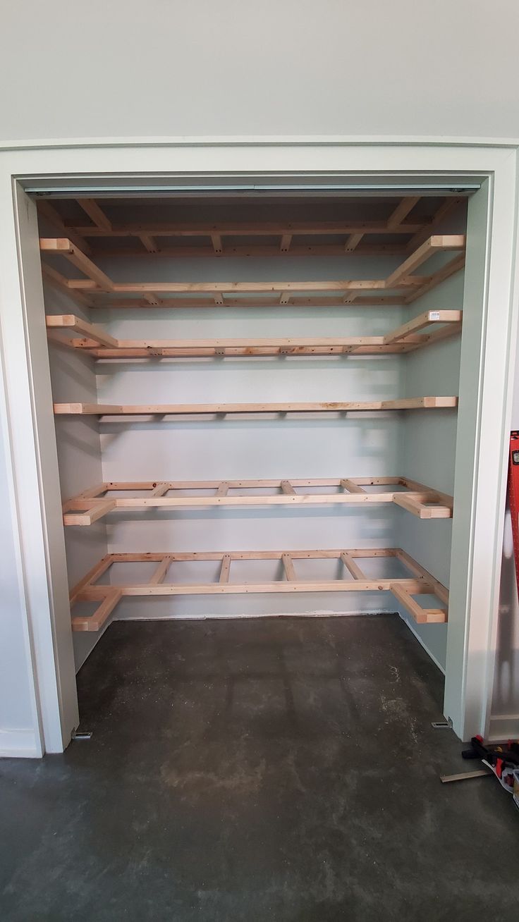 an empty room with shelves and tools in it