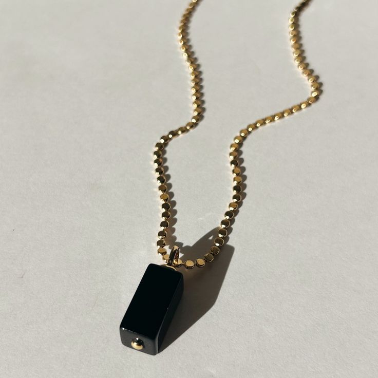 Introducing the Elixir Necklace - this one is for the minimalist girly. She's sophisticated & will add value to your personal style. Some believe that the Onyx stones are associated with love, protection & courage. Others believe that black onyx stones are used to create balance & harmony in the wearer's life. The Elixir Necklace will make you magnetic! Product Details: 18" 14K Gold-Filled Flat Ball Chain 24mm Black Onyx Charm Water-Wearable Made in Scottsdale, AZ Black Onyx Stone, The Minimalist, Solid Gold Jewelry, Scottsdale Az, Onyx Stone, Gold Filled Jewelry, Ball Chain, Black Onyx, Jewelry Care