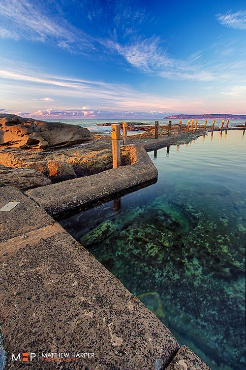 the water is crystal blue and clear at this time of day, it's hard to see