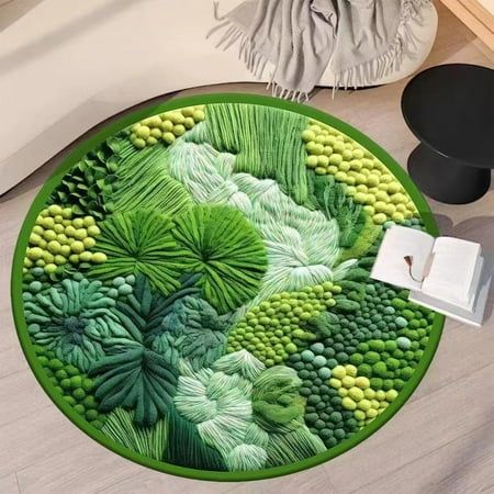 a round rug with green leaves on it