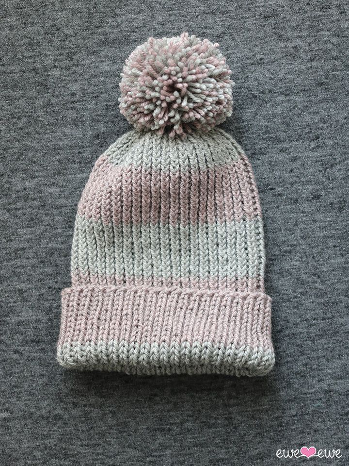 a knitted hat with a pom - pom on top