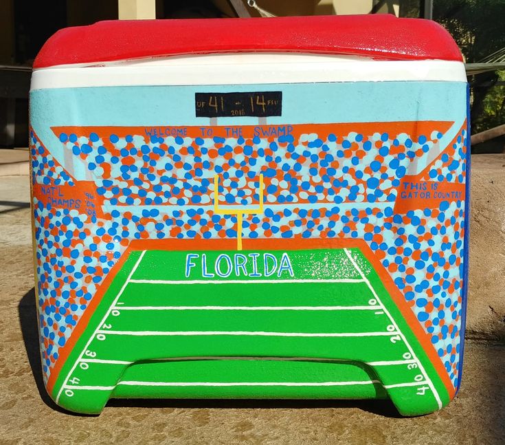 a cooler with the name florida on it and a football field painted on it's side