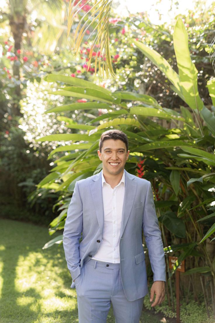 a man in a blue suit and white shirt