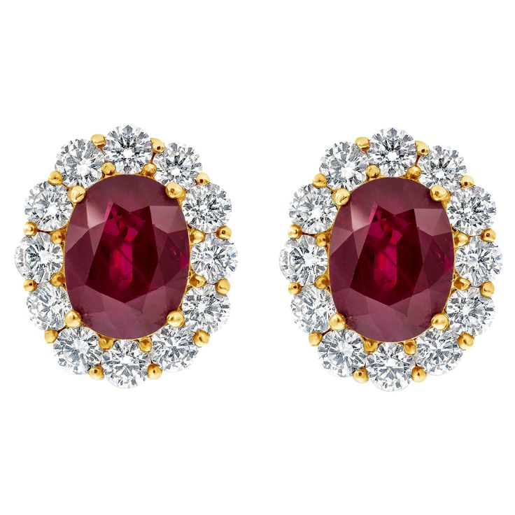 A pleasing pair of gemstone earrings features two color rich GIA Certified oval cut heated rubies weighing 5.69 carats total, surrounded by a single row of brilliant round diamonds in a halo design weighing 2.14 carats total. Made in 18K Yellow Gold. Style available in different price ranges. Prices are based on your selection. Please contact us for more information. Classic Halo Engagement Ring, Contemporary Wedding Rings, Timeless Engagement Ring, Ruby Earrings Studs, Diamond Earrings Studs Round, Round Diamond Setting, Fancy Yellow Diamond, Engagement Ring Diamond Cut, Halo Earrings