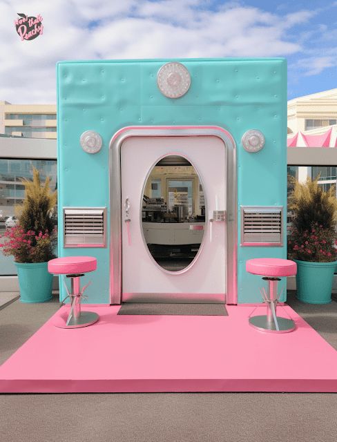 a pink and blue booth with stools on the floor in front of an entrance