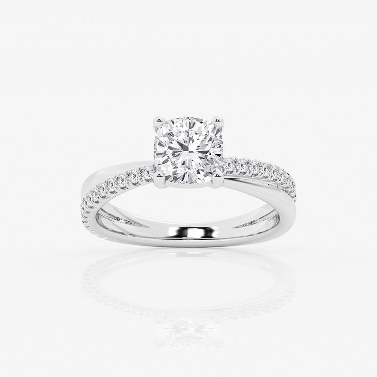 a diamond engagement ring on a white background