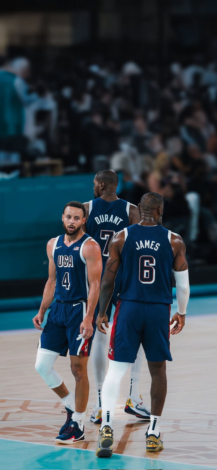 two basketball players are talking to each other