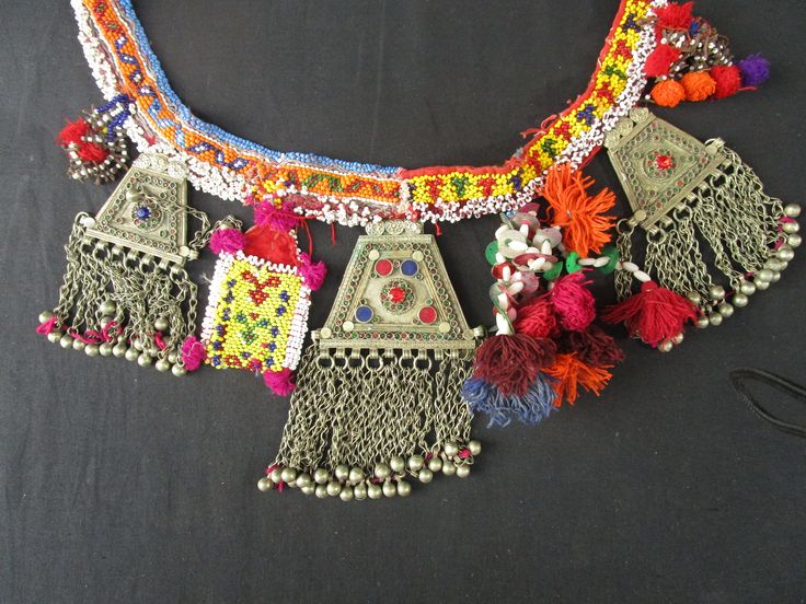 "This is actually a bandolier worn by a child over the shoulder. it can be used as a belt or any ornate decor . it measures 38 inches around. wrap beads and lots of fun added items. cloves - pom poms - dangles This is an original piece. there might be some imperfections but for the most part it is in great shape part of the collection from my purchases 1993-2006 in Pakistan with the Afghan traders notice its actually 2 pieces of different bead work connected at bottom- it came like this obviousl Ornate Decor, Afghan Jewelry, Vintage Vest, Wedding Jewellery Necklace, Pom Poms, Wedding Necklace, Wearable Art, Pre Wedding, A Child