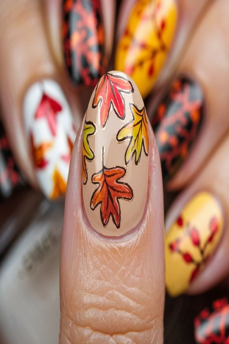 Celebrate the beauty of fall with this Autumn Leaves Nail Art. Featuring intricate designs of leaves in vibrant autumn colors like red, orange, and yellow, this nail art captures the essence of the season. Fall Nails With Leaf Design, Leaf Nails Design, Fall Leaves Nails, Fall Leaf Nails, Autumn Nail Art Designs, Fall Leaf Nail Art, Easy Fall Nail Designs, Leaves Nail Art, Bright Orange Nails