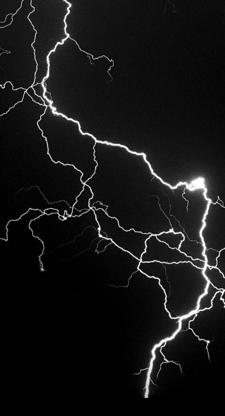 a black and white photo of lightning in the sky