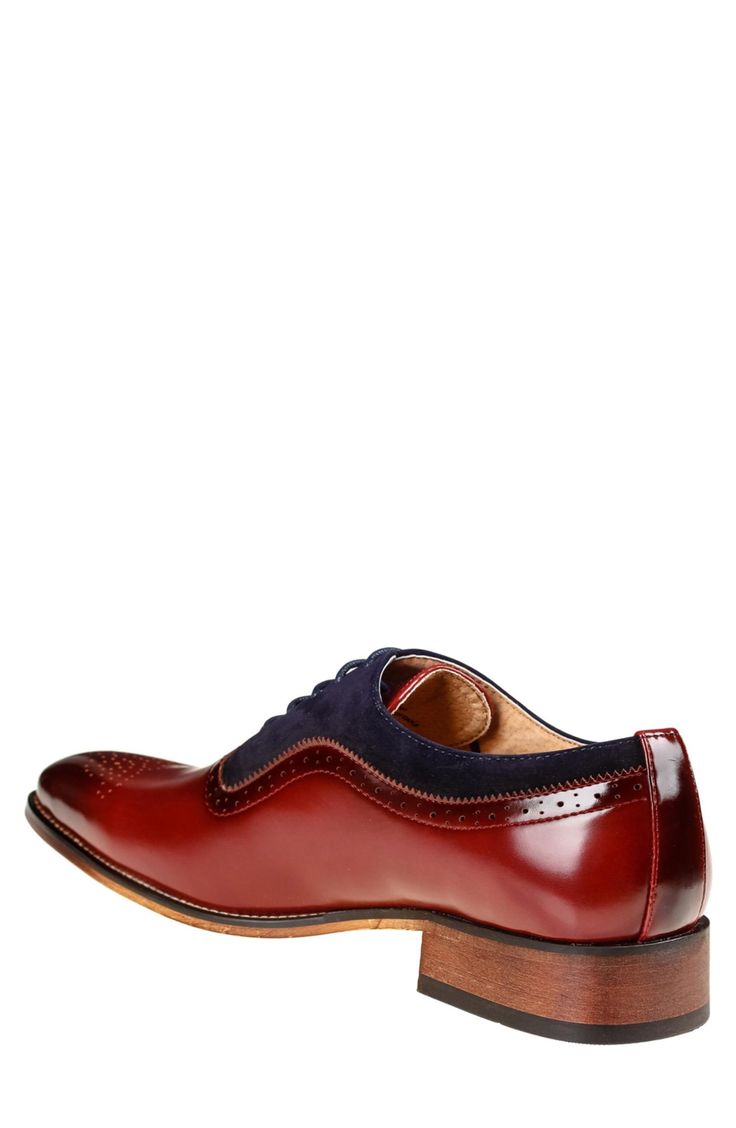 A brogued wingtip toe complements the velvet trim of this classic oxford that's sure to add professional polish to any ensemble. Synthetic upper/leather lining/rubber sole Imported Wingtip Leather Shoes With Contrast Sole For Work, Fall Business Casual Oxfords With Brogue Detailing, Classic Wingtip Leather Shoes With Contrast Sole, Classic Formal Oxfords With Contrast Sole, Elegant Oxfords With Contrast Sole, Classic Dress Shoes With Contrast Sole For Formal Occasions, Classic Suede Wingtip Dress Shoes, Patent Leather Wingtip Oxfords For Business Casual, Classic Wingtip Oxfords With Contrast Sole